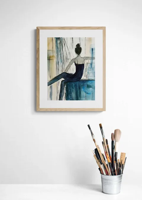 Elegant Seated Female Figure in Blue