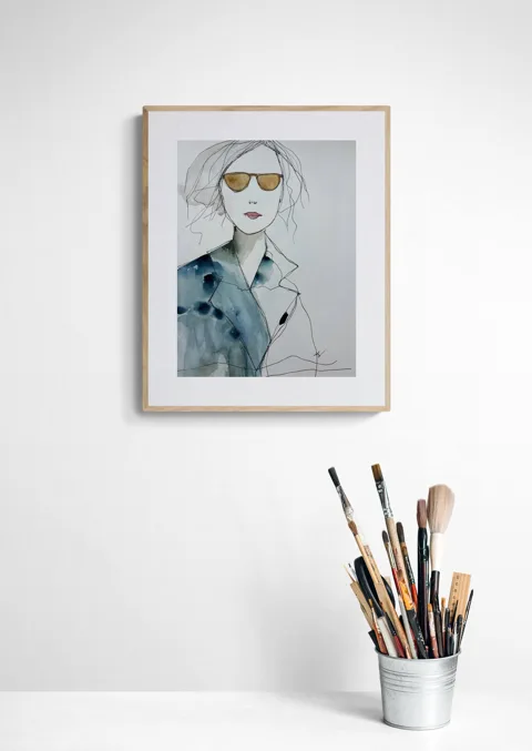 Stylish Woman in Golden Sunglasses and Blue Coat
